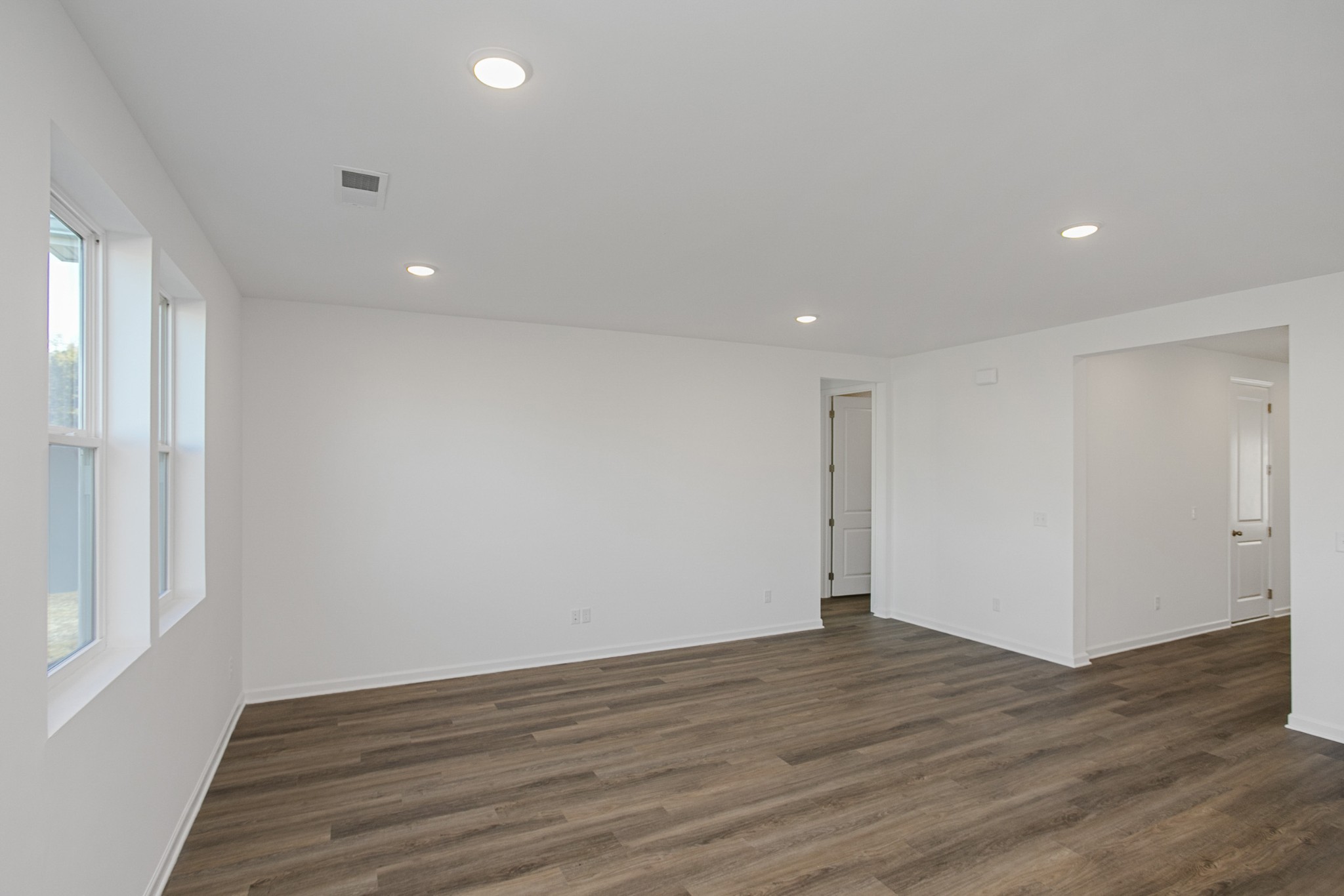604 Maple Bend Dickson, TN 37055 - Photo 14 of 39 wooden floor in an empty room with a window