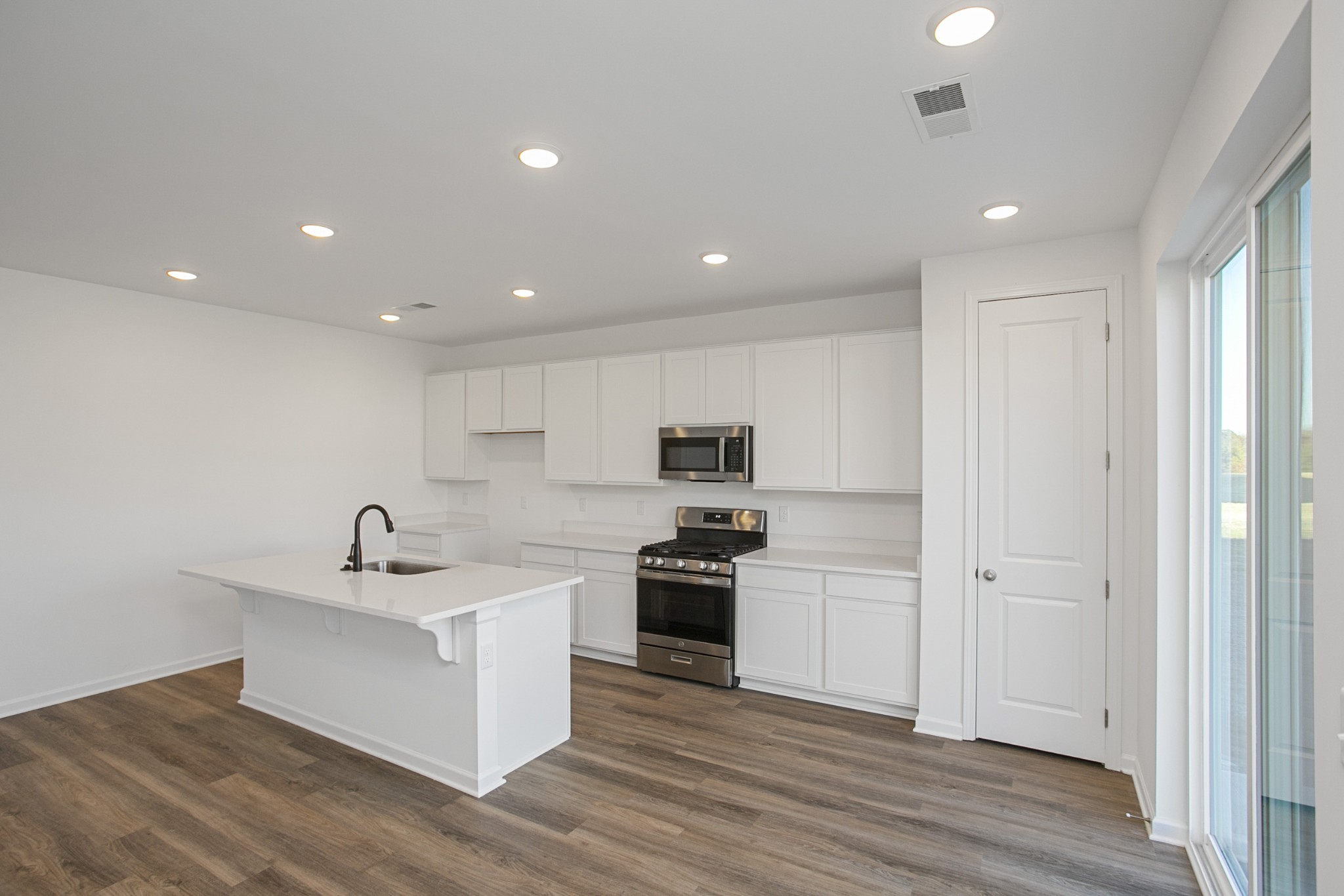 604 Maple Bend Dickson, TN 37055 - Photo 15 of 39 a kitchen with a sink stainless steel appliances and cabinets