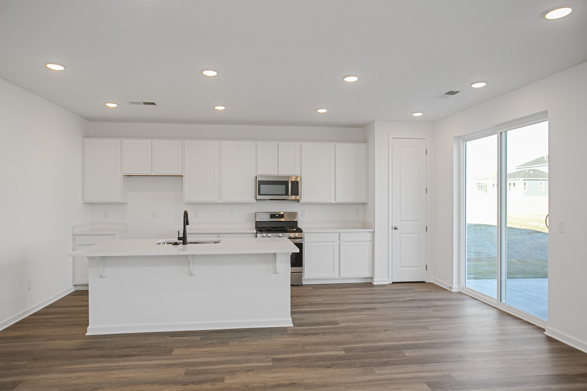604 Maple Bend Dickson, TN 37055 - Photo 16 of 39 a view of kitchen with stainless steel appliances granite countertop a sink a stove and a refrigerator