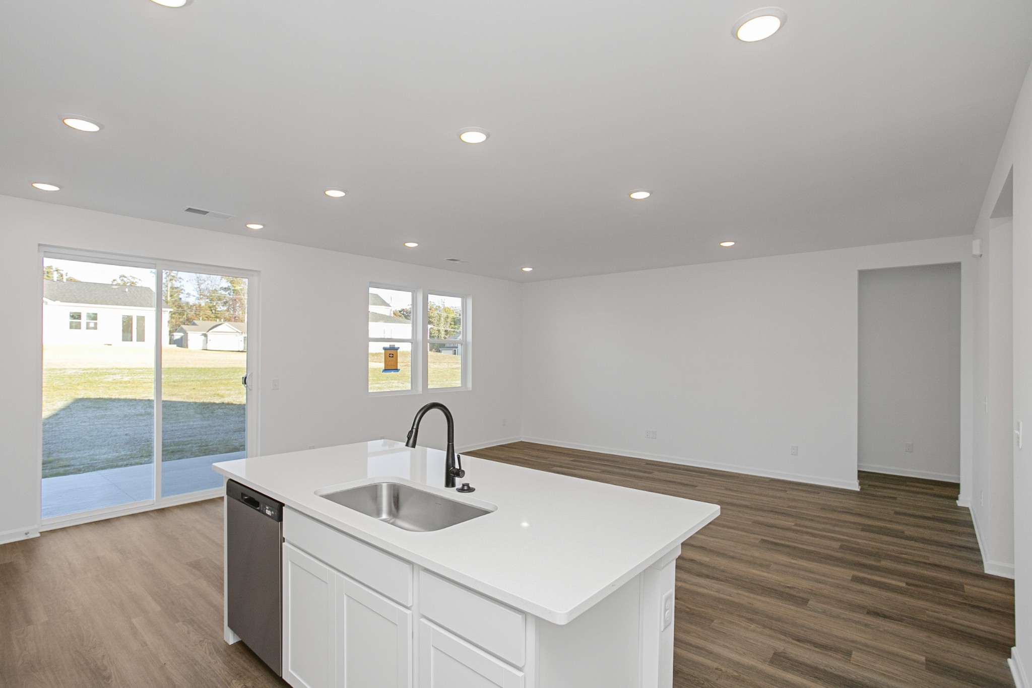 604 Maple Bend Dickson, TN 37055 - Photo 18 of 39 a kitchen with a sink and wooden floor