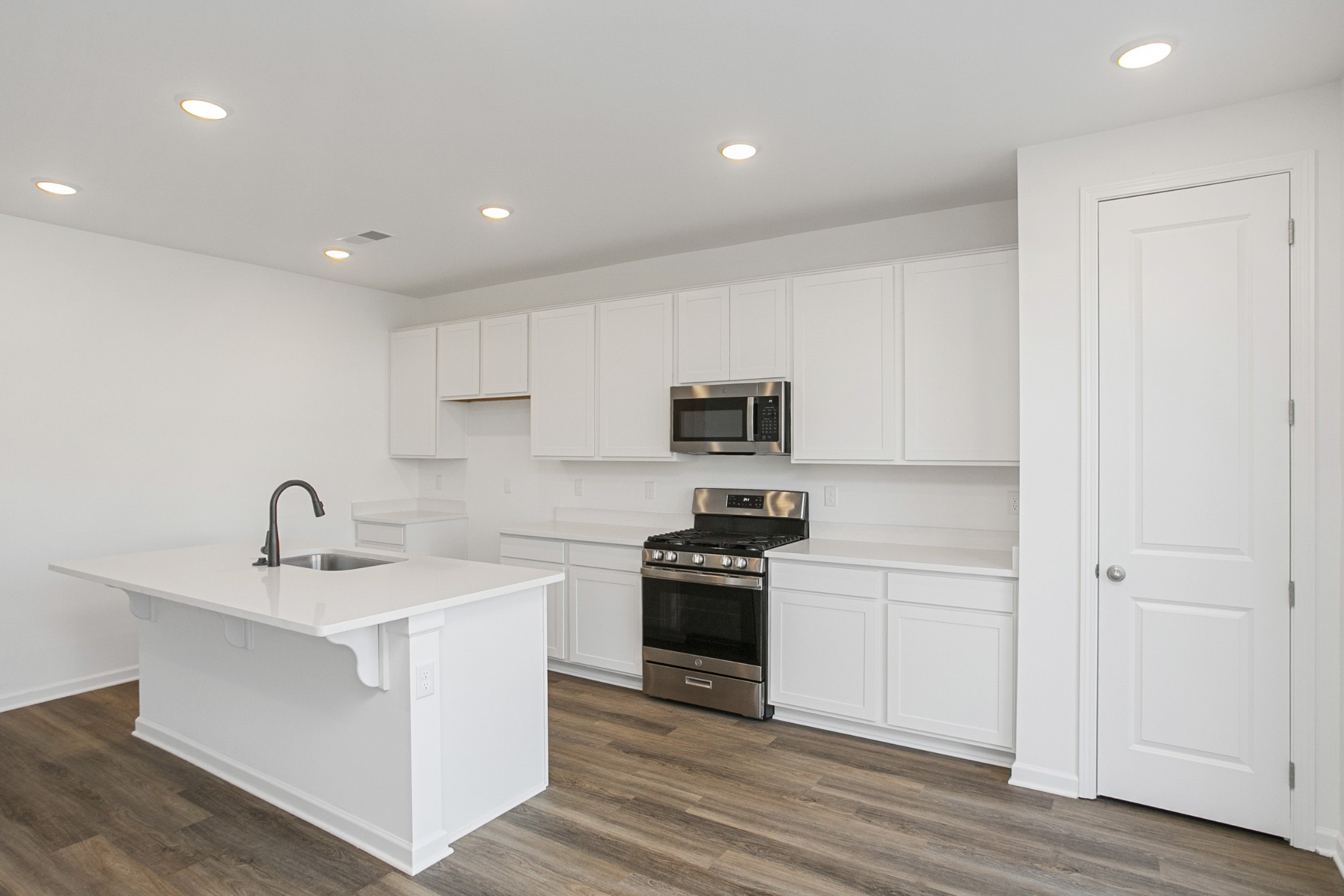 604 Maple Bend Dickson, TN 37055 - Photo 20 of 39 a kitchen with stainless steel appliances a sink stove and refrigerator