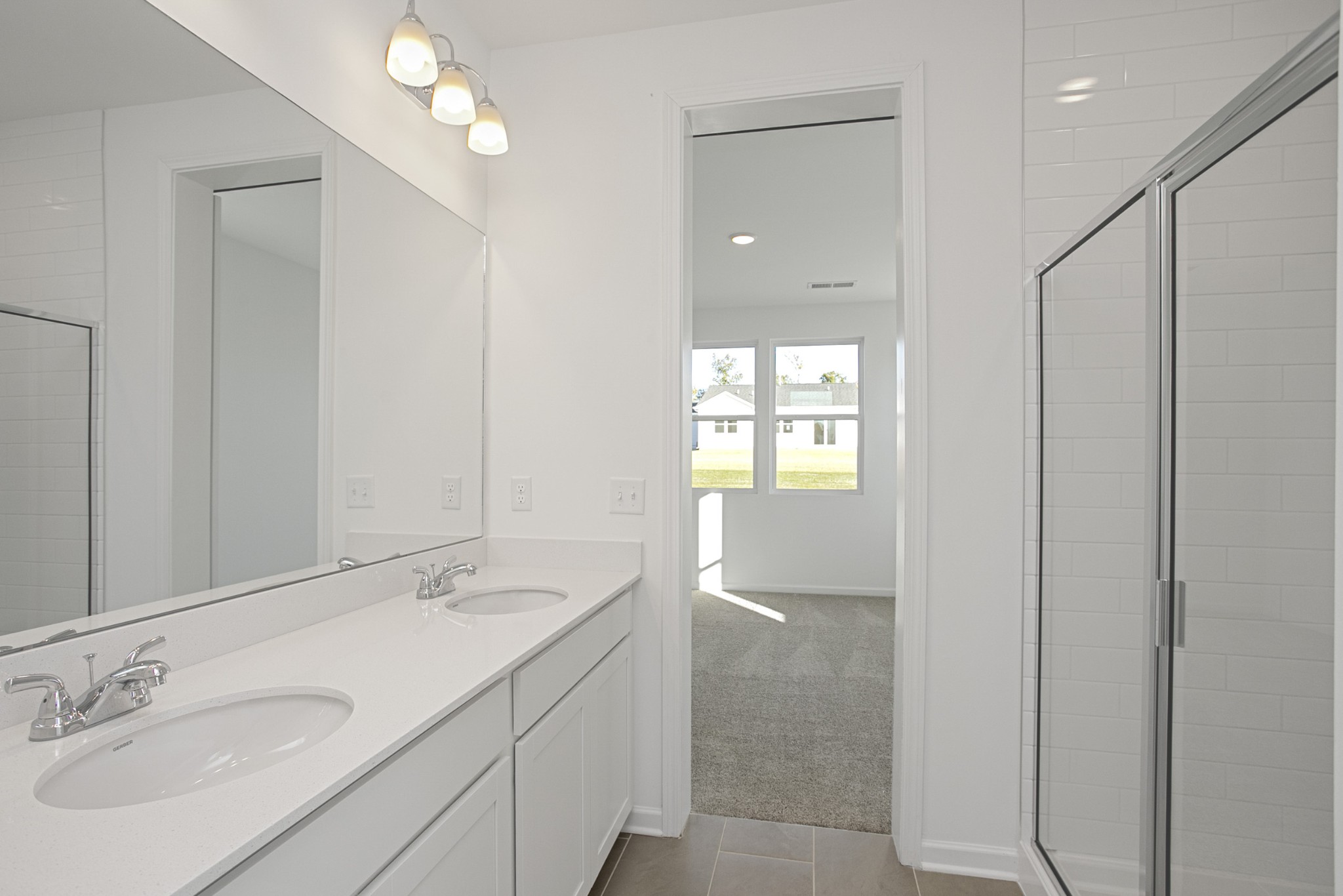 604 Maple Bend Dickson, TN 37055 - Photo 28 of 39 a bathroom with a sink and a mirror