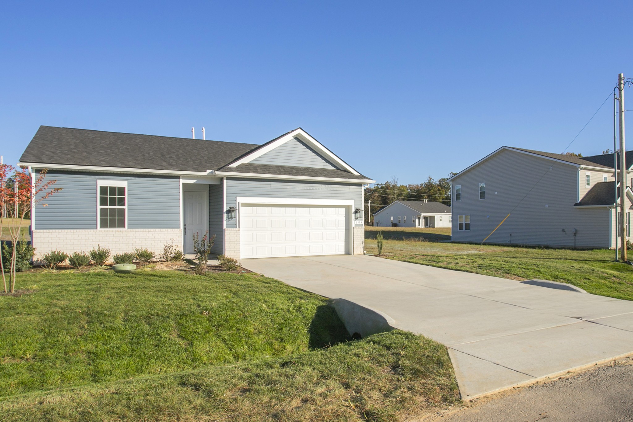 604 Maple Bend Dickson, TN 37055 - Photo 37 of 39 a front view of a house with a yard and garage