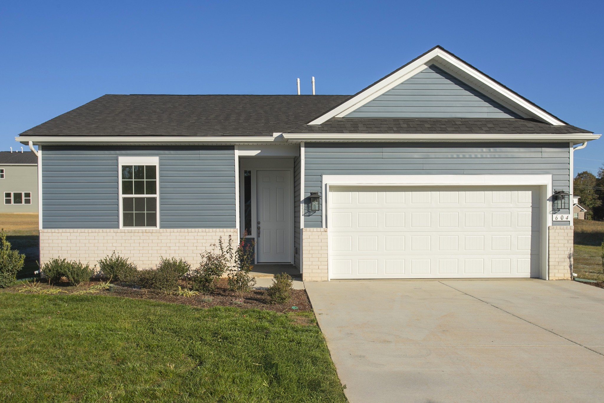 604 Maple Bend Dickson, TN 37055 - Photo 39 of 39 a front view of a house with garage