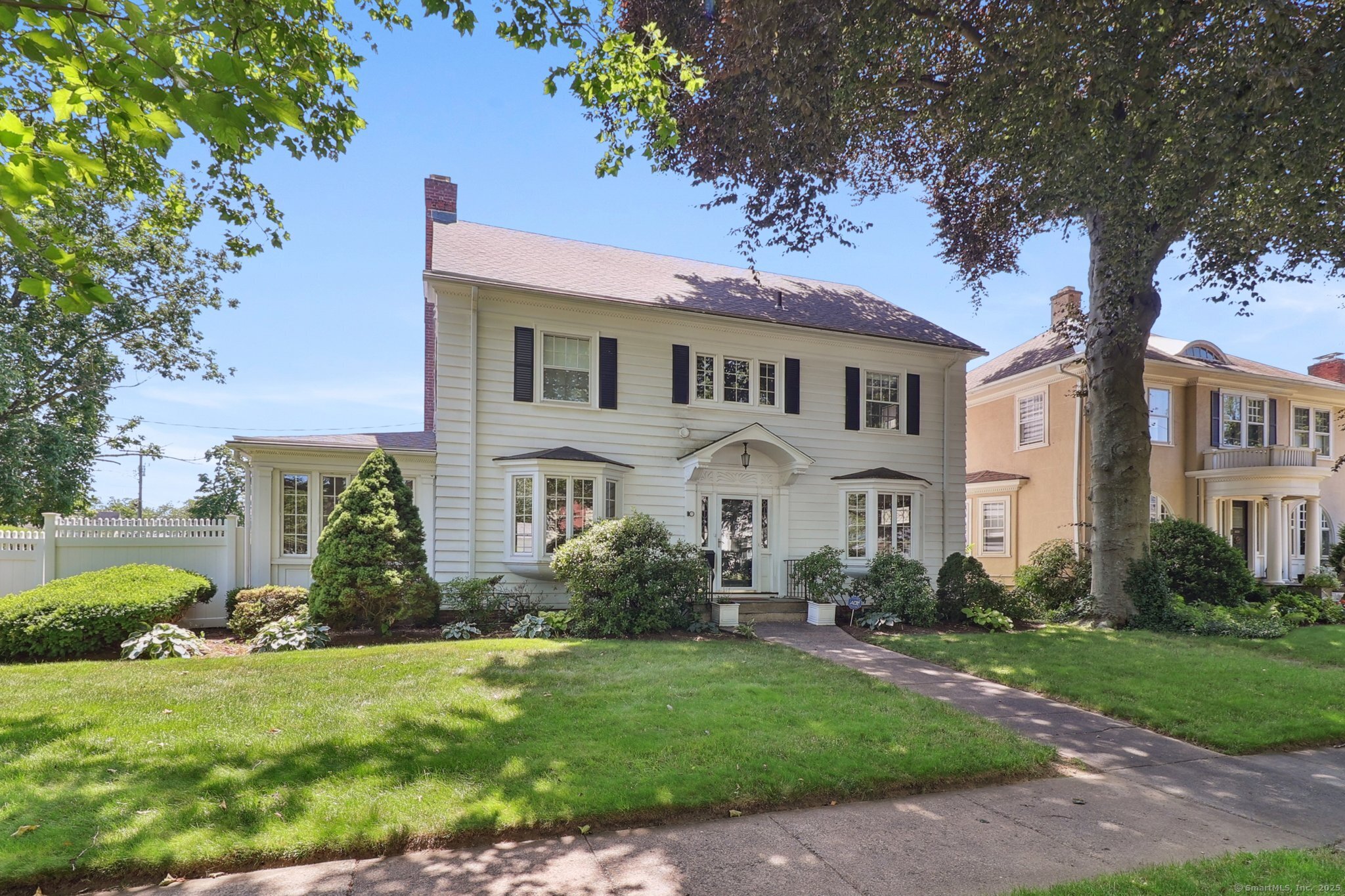 110 Westwood Road New Haven, CT 06515 - Photo 1 of 1 a front view of a house with a garden