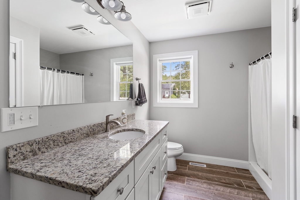 237 Glendale Road Northampton, MA 01062 - Photo 17 of 42 a bathroom with a granite countertop sink and a mirror