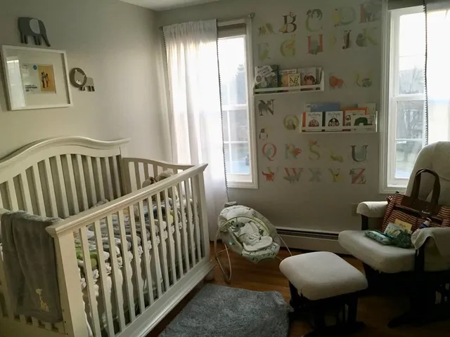 a bedroom with furniture and a window