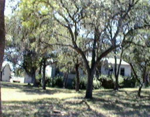 1644 Old Post Road San Marcos, TX 78666 - Photo 1 of 1 a view of a yard with a house