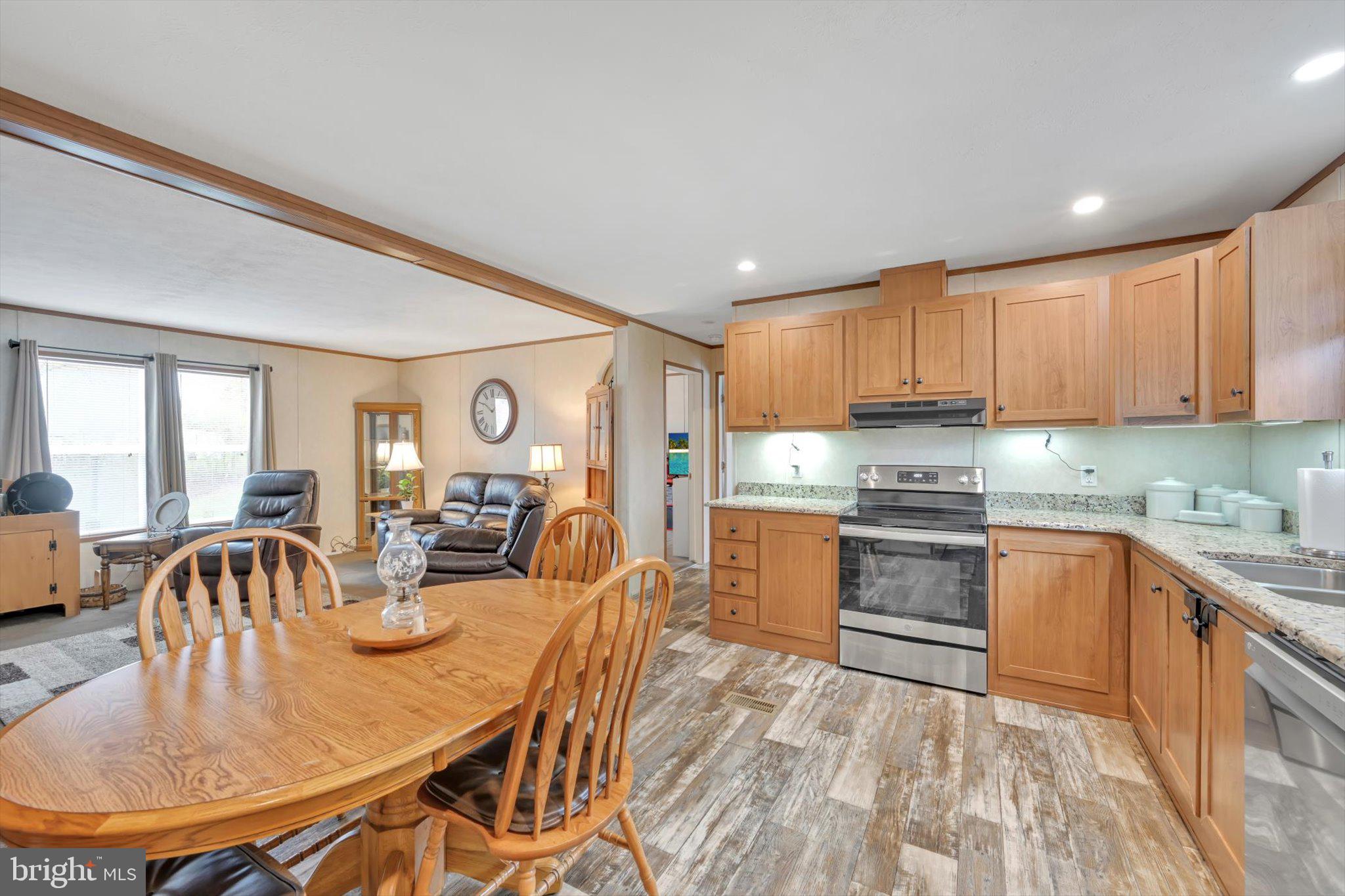 185 Weidler Lane Lititz, PA 17543 - Photo 8 of 25 a kitchen with stainless steel appliances granite countertop a kitchen island a stove a table and chairs