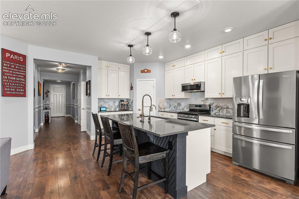 12781 Granite Ridge Drive Peyton, CO 80831 - Photo 12 of 41 Stainless Appliances and a Chevron Island are just the tip of the iceberg here.