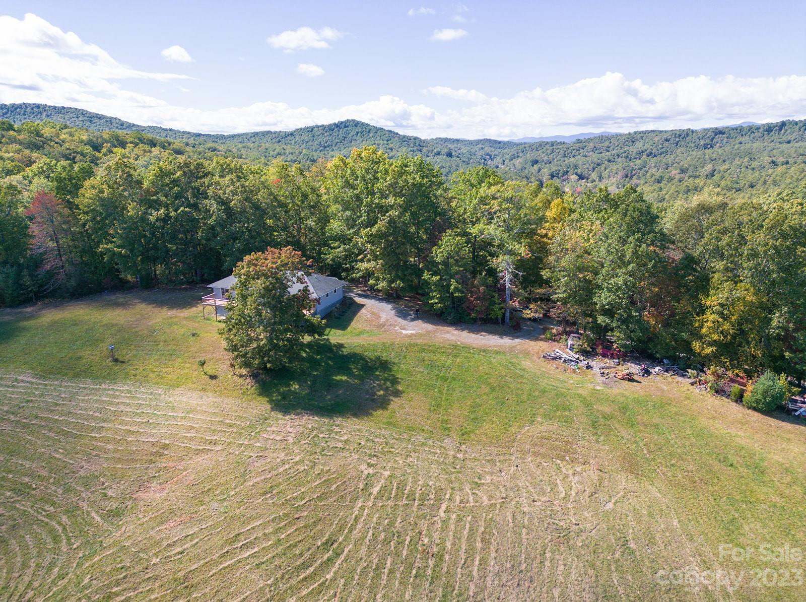 348 Becky Mountain Road Brevard, NC 28712 - Photo 14 of 26 a view of a lake with a mountain