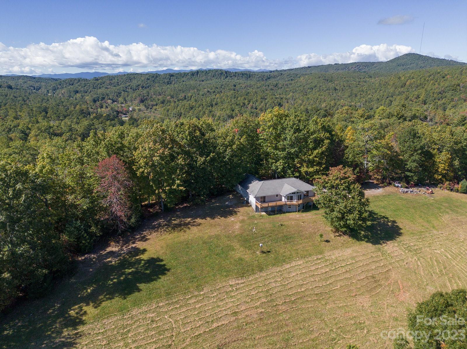 348 Becky Mountain Road Brevard, NC 28712 - Photo 16 of 26 a view of a lake with a mountain