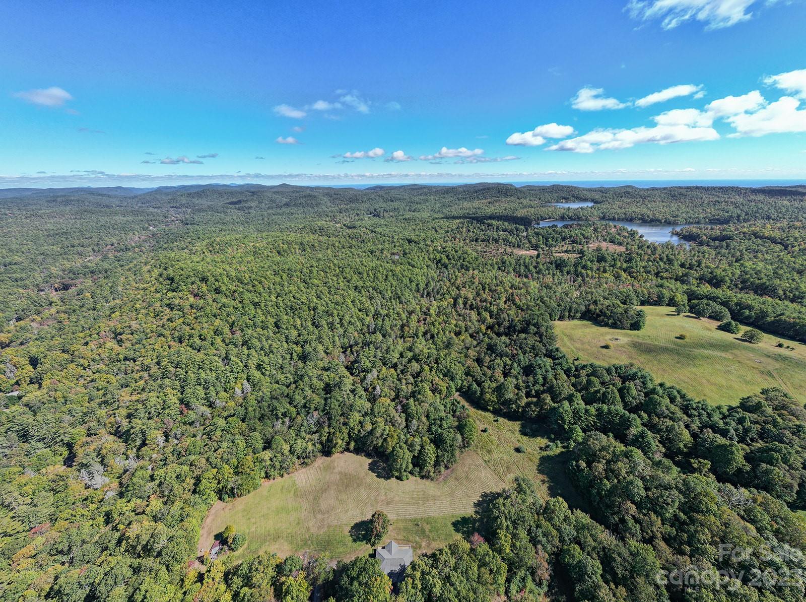 348 Becky Mountain Road Brevard, NC 28712 - Photo 18 of 26 a view of a lake with a mountain