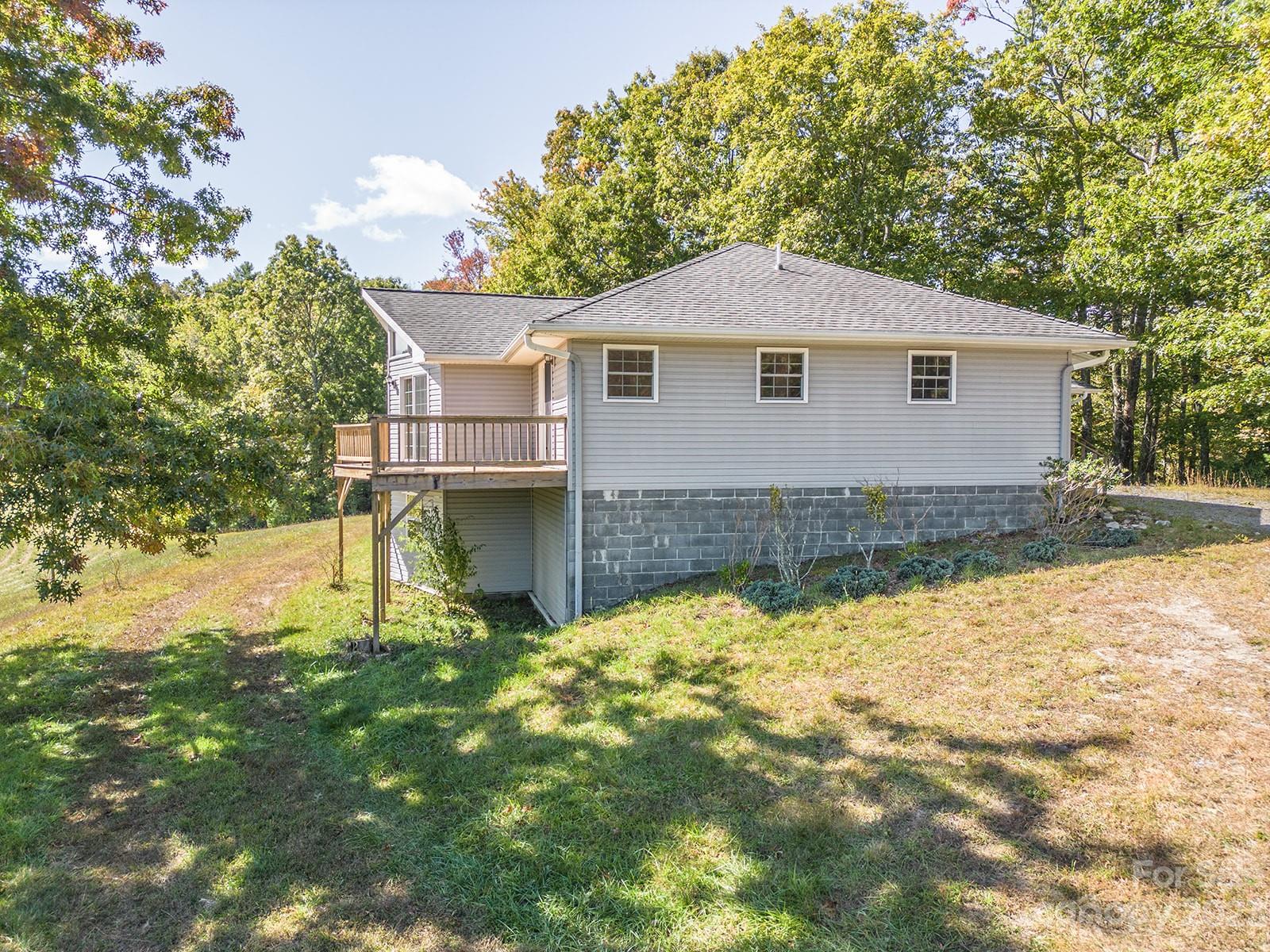 348 Becky Mountain Road Brevard, NC 28712 - Photo 20 of 26 a front view of a house with a yard