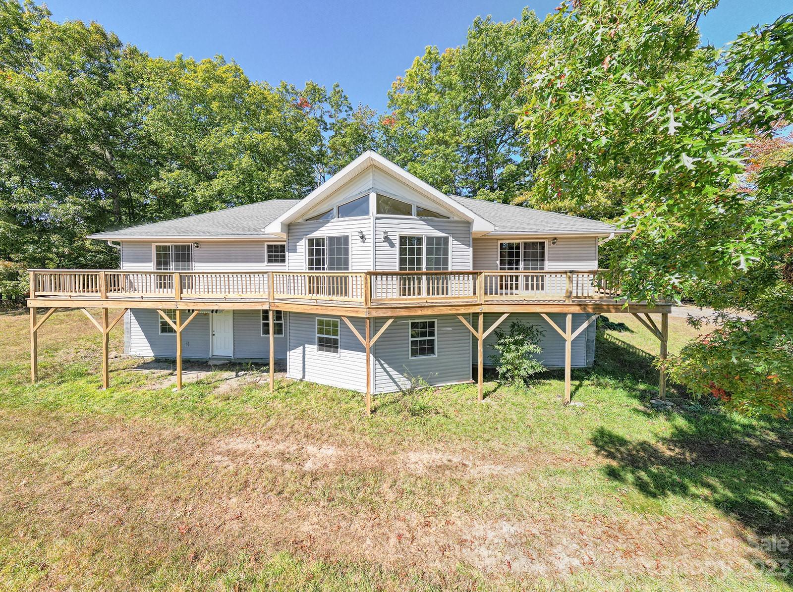 348 Becky Mountain Road Brevard, NC 28712 - Photo 21 of 26 a house that has a table and chairs in it