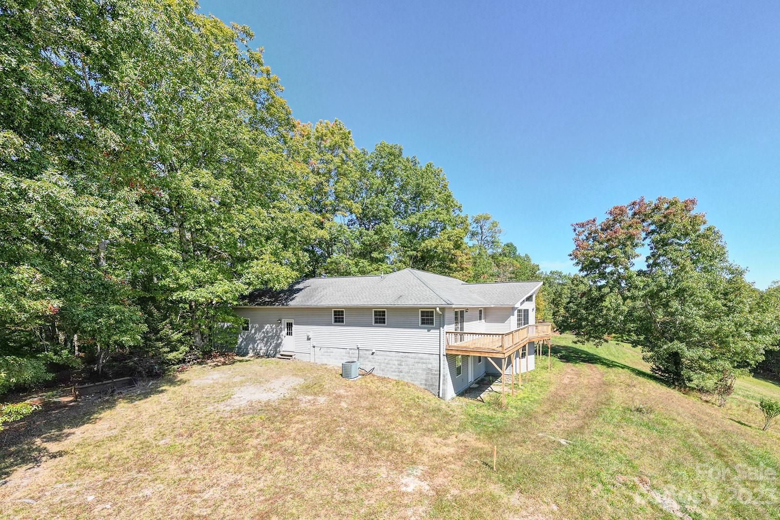 348 Becky Mountain Road Brevard, NC 28712 - Photo 22 of 26 a house with trees in the background