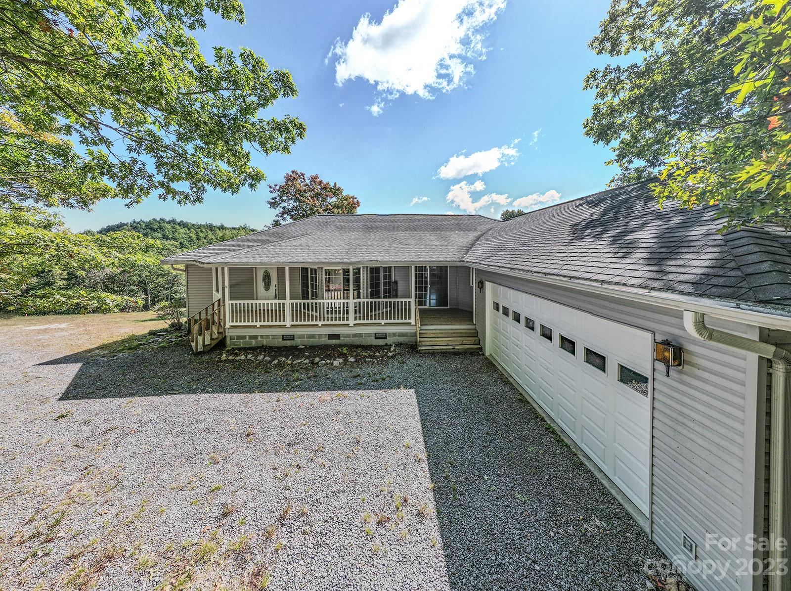 348 Becky Mountain Road Brevard, NC 28712 - Photo 23 of 26 a view of a house with a yard