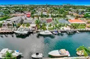 a view of a lake with a table and a chairs
