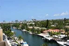 an aerial view of a city with lake view