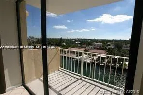 a view of a balcony with wooden floor