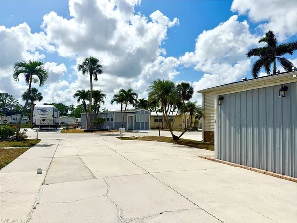 a view of a backyard of the house