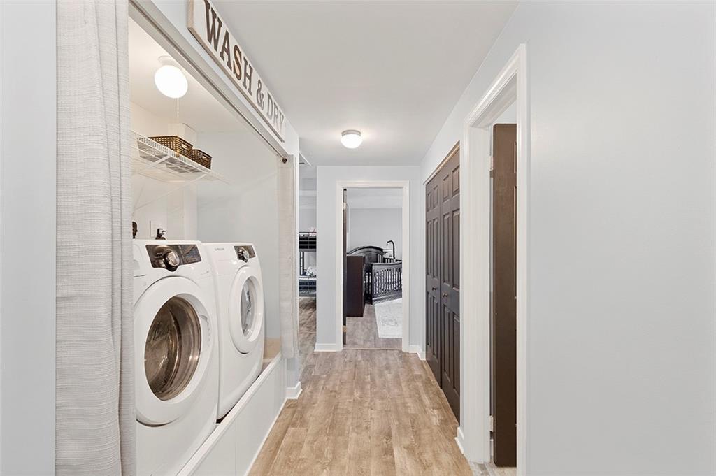 196 Cochran Road Pittsburgh, PA 15228 - Photo 13 of 25 a view of a hallway with washer and dryer