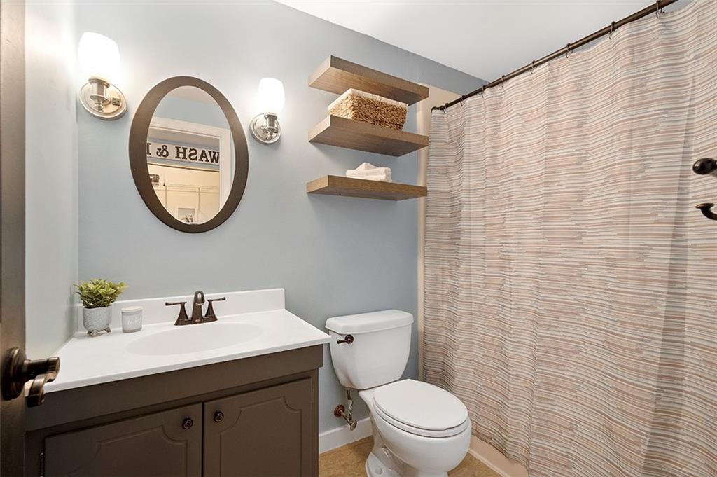 196 Cochran Road Pittsburgh, PA 15228 - Photo 14 of 25 a bathroom with a toilet and a sink