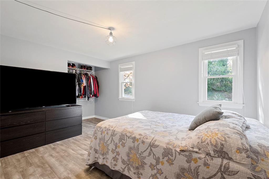 196 Cochran Road Pittsburgh, PA 15228 - Photo 17 of 25 a bedroom with a bed and a flat screen tv