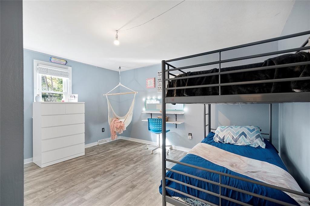 196 Cochran Road Pittsburgh, PA 15228 - Photo 18 of 25 a bedroom with a bed and a window