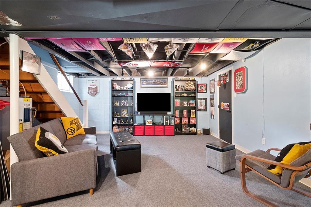196 Cochran Road Pittsburgh, PA 15228 - Photo 20 of 25 a living room with furniture and a flat screen tv