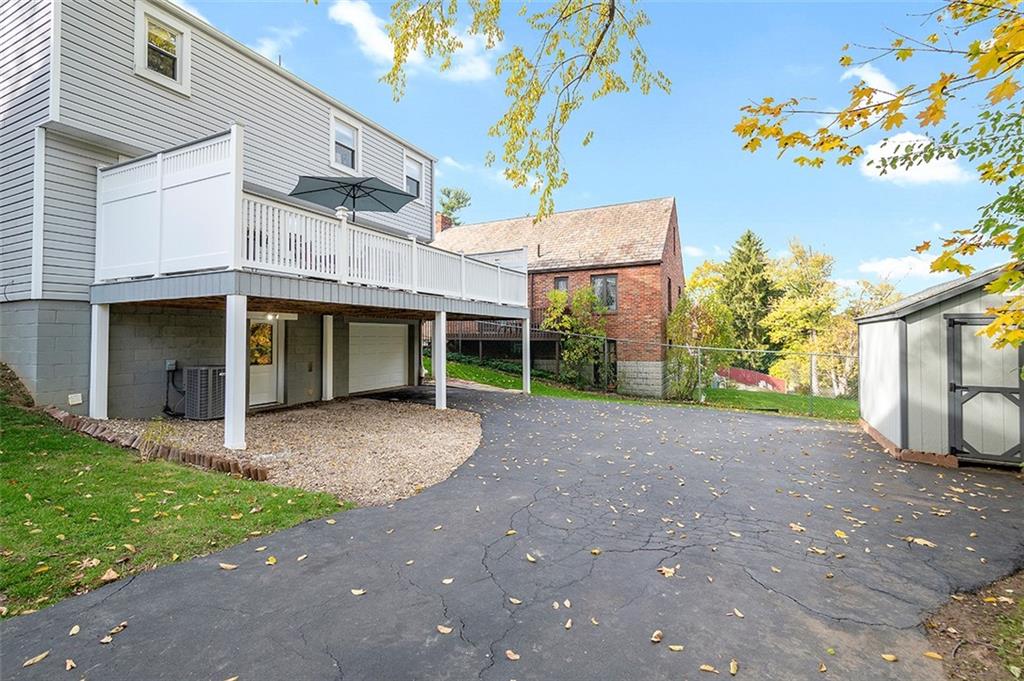 196 Cochran Road Pittsburgh, PA 15228 - Photo 22 of 25 a view of a house with a yard and potted plants