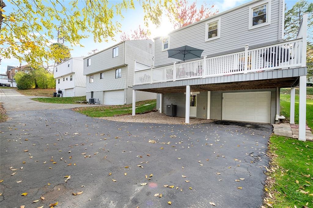 196 Cochran Road Pittsburgh, PA 15228 - Photo 23 of 25 a view of a house with a yard and large tree