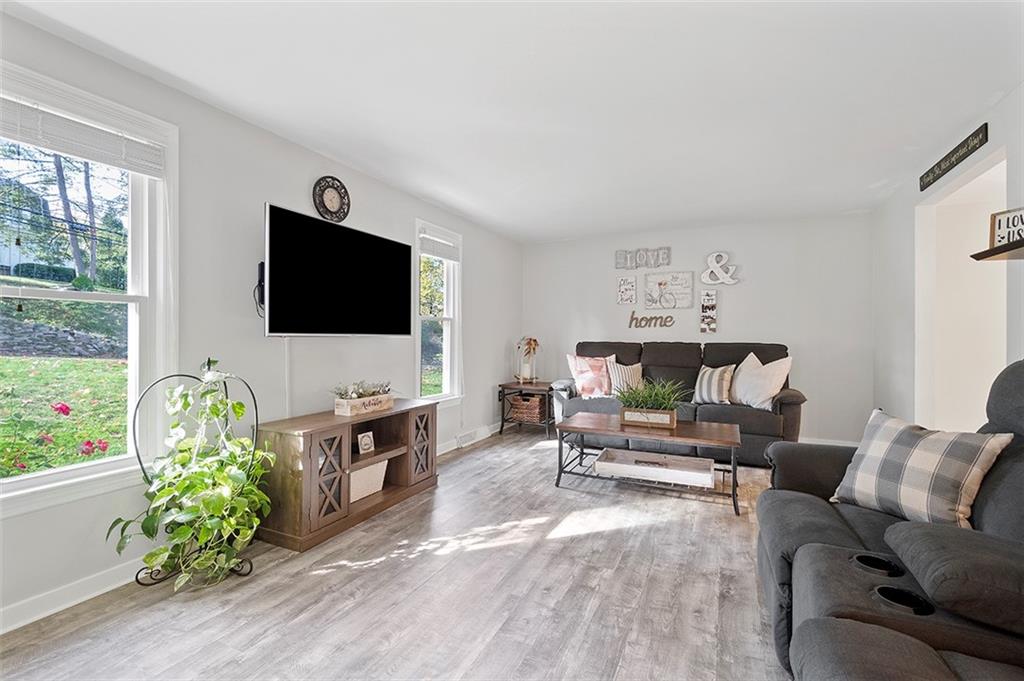 196 Cochran Road Pittsburgh, PA 15228 - Photo 4 of 25 a living room with furniture and a flat screen tv