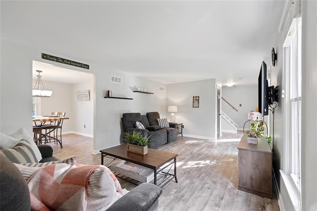 196 Cochran Road Pittsburgh, PA 15228 - Photo 5 of 25 a living room with furniture and a fireplace