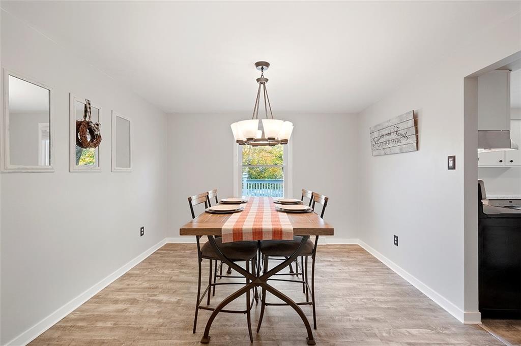 196 Cochran Road Pittsburgh, PA 15228 - Photo 6 of 25 a dining room with furniture window and wooden floor