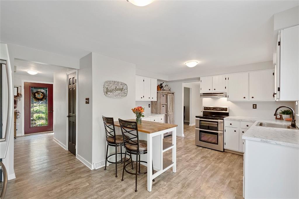 196 Cochran Road Pittsburgh, PA 15228 - Photo 7 of 25 a kitchen that has a lot of cabinets a sink and appliances in it