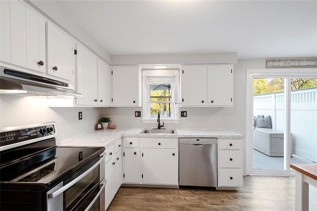 196 Cochran Road Pittsburgh, PA 15228 - Photo 9 of 25 a kitchen with cabinets appliances and a window