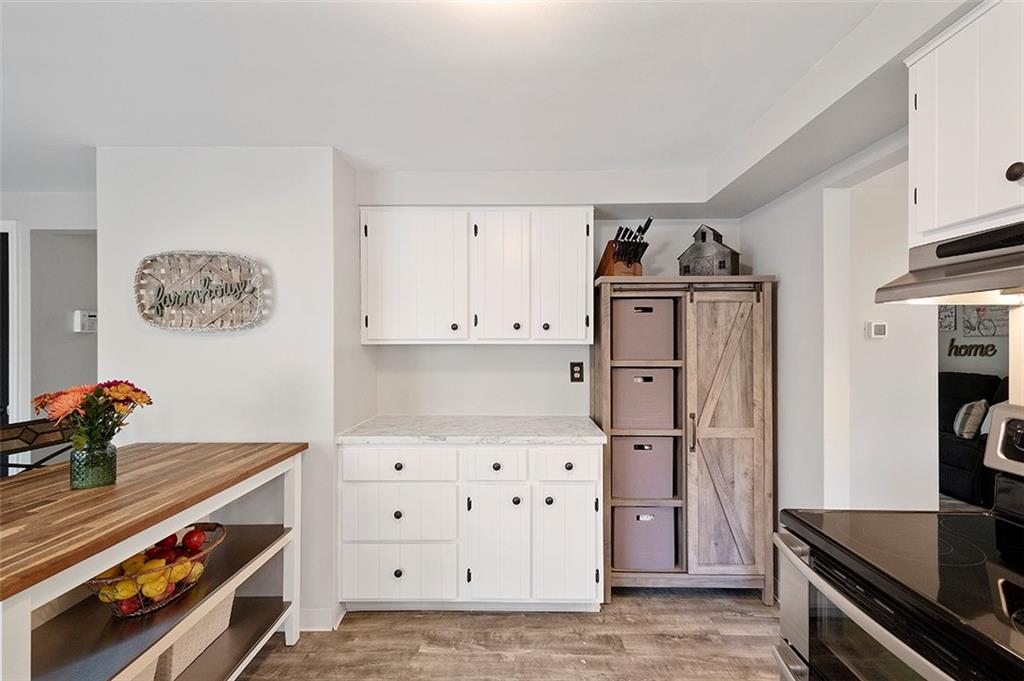 196 Cochran Road Pittsburgh, PA 15228 - Photo 10 of 25 a kitchen with stainless steel appliances a stove and a refrigerator