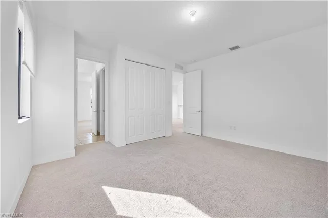 a white toilet sitting next to a bath tub