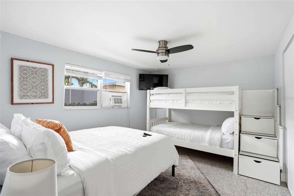 2311 Bay Boulevard Indian Rocks Beach, FL 33785 - Photo 28 of 80 a bedroom with a large bed and a window