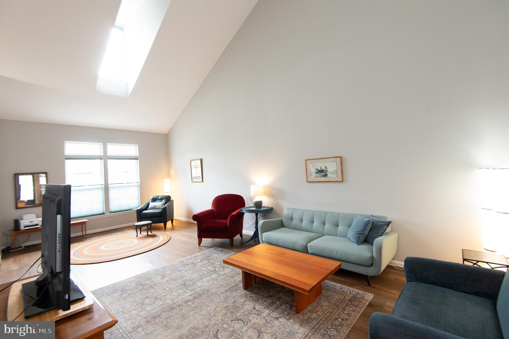 47 Brighton Street Ocean View, DE 19970 - Photo 11 of 44 a living room with furniture and a flat screen tv