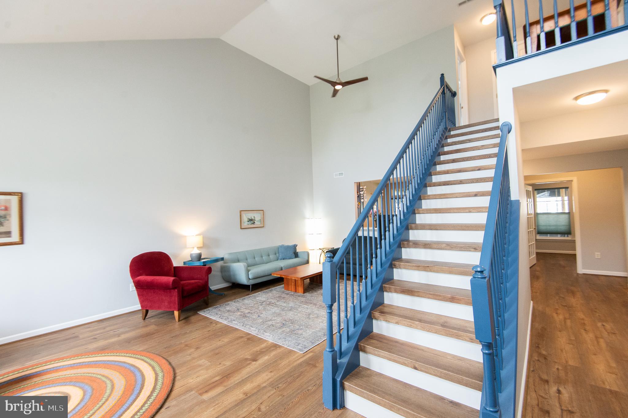 47 Brighton Street Ocean View, DE 19970 - Photo 13 of 44 a living room with furniture and a floor to ceiling window