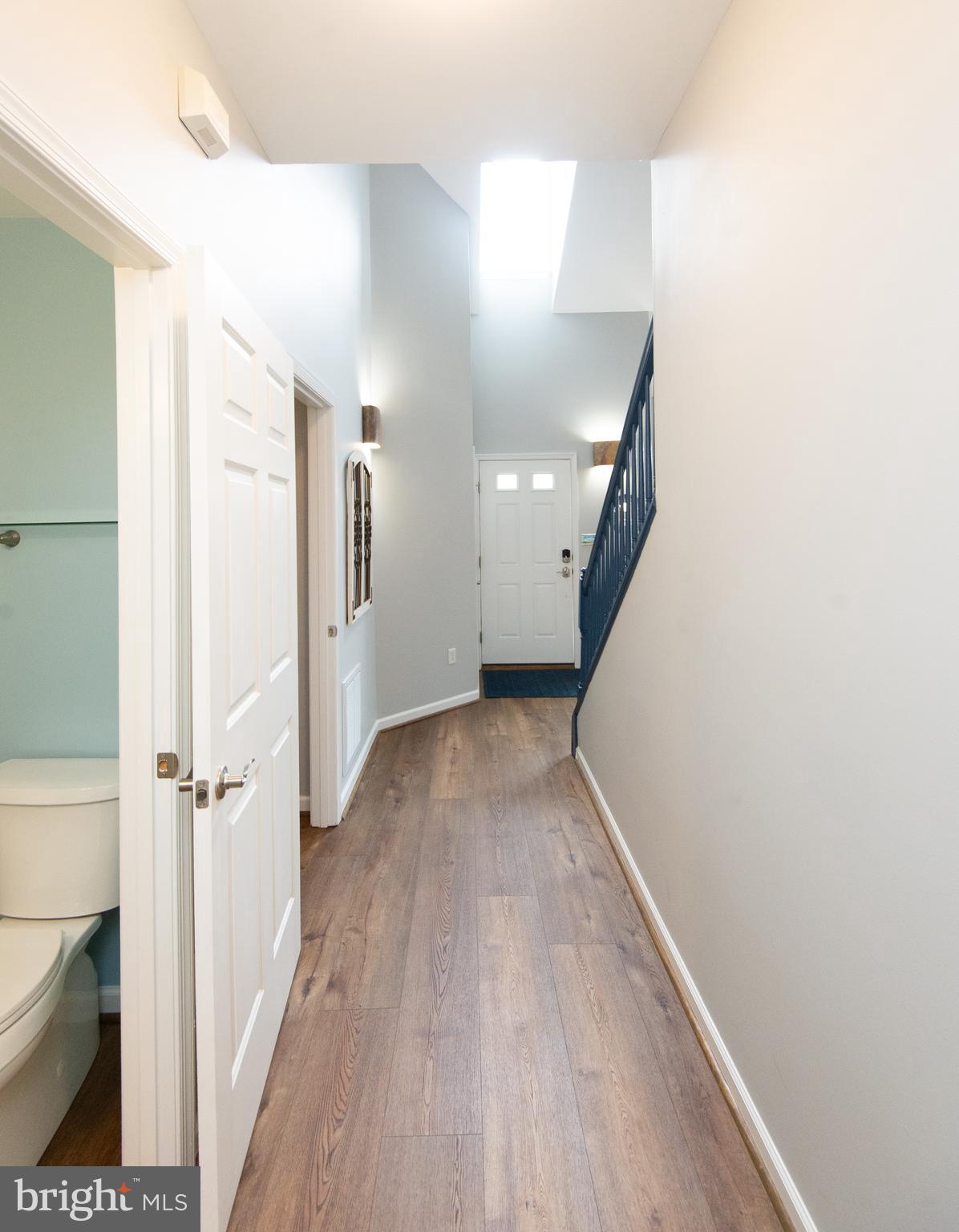 47 Brighton Street Ocean View, DE 19970 - Photo 14 of 44 a view of a hallway with wooden floor and staircase
