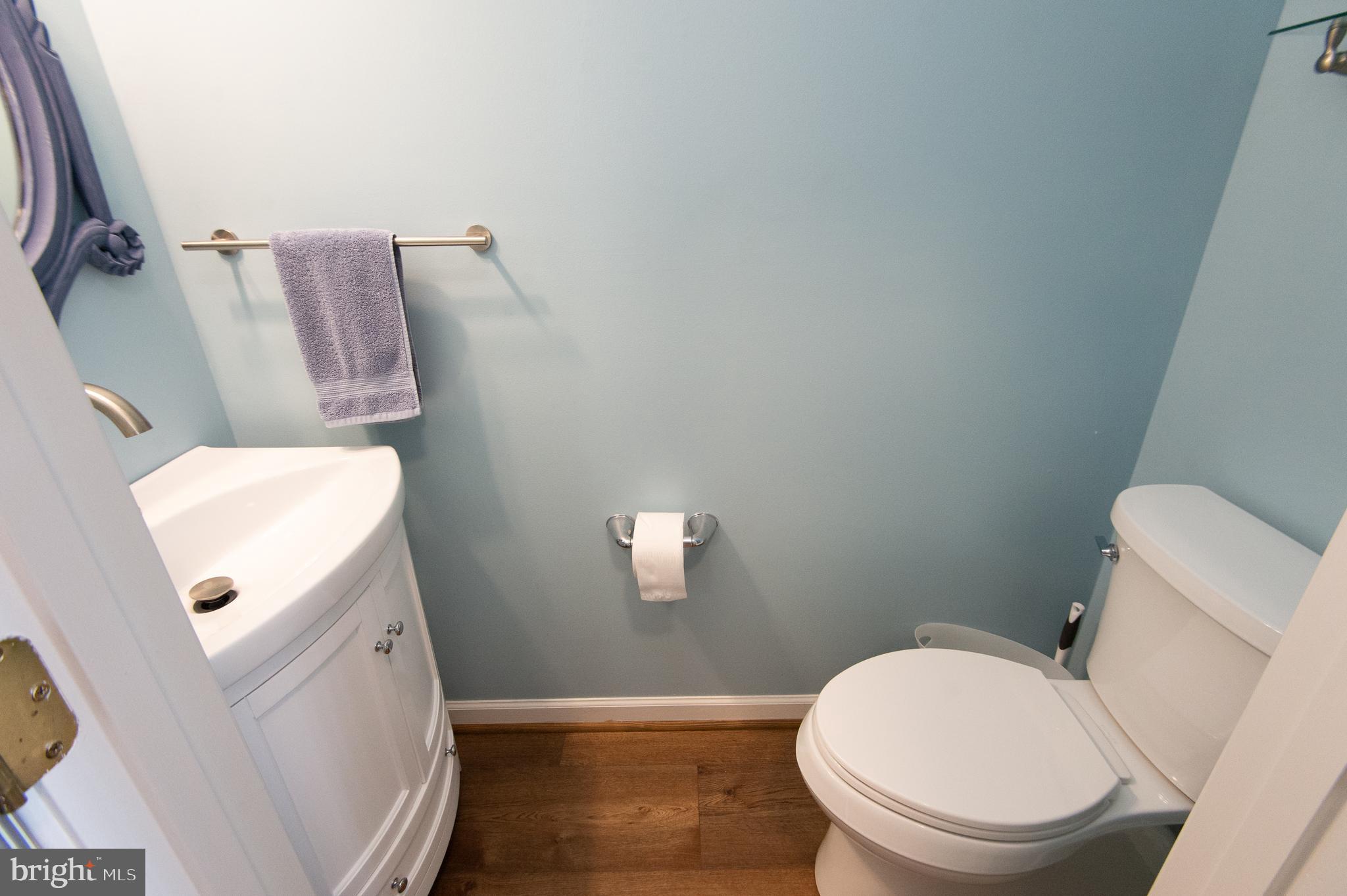 47 Brighton Street Ocean View, DE 19970 - Photo 16 of 44 a white toilet sitting next to a wooden floor