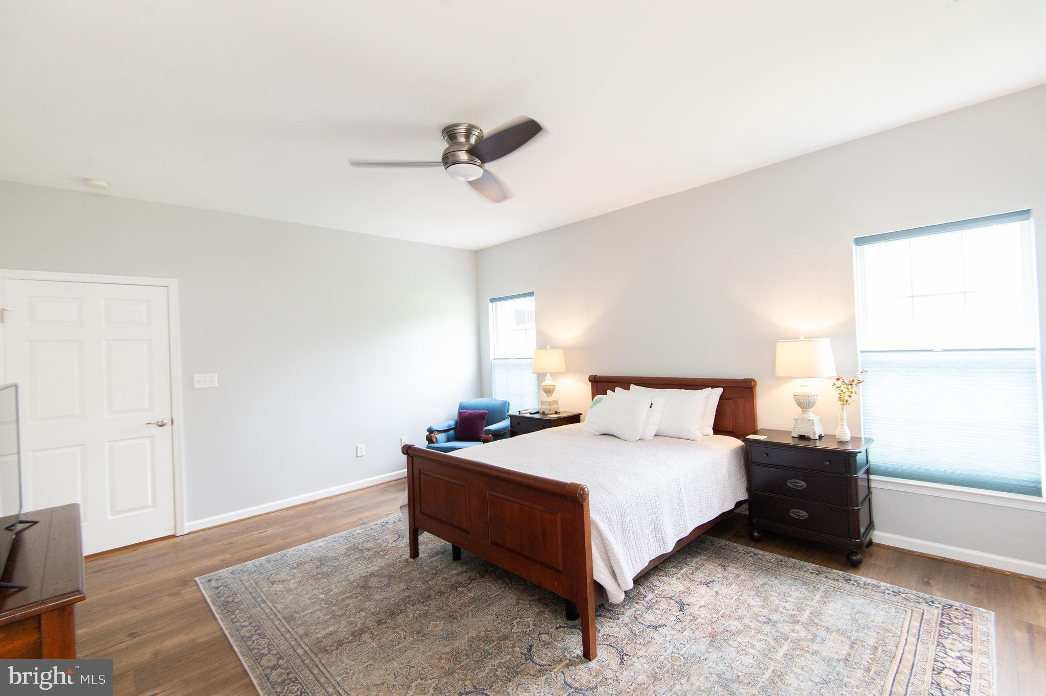 47 Brighton Street Ocean View, DE 19970 - Photo 22 of 44 a bedroom with a bed and wooden floor