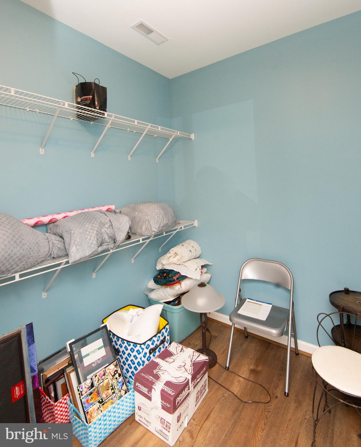 47 Brighton Street Ocean View, DE 19970 - Photo 25 of 44 a room with stainless steel appliances wooden floor and a table