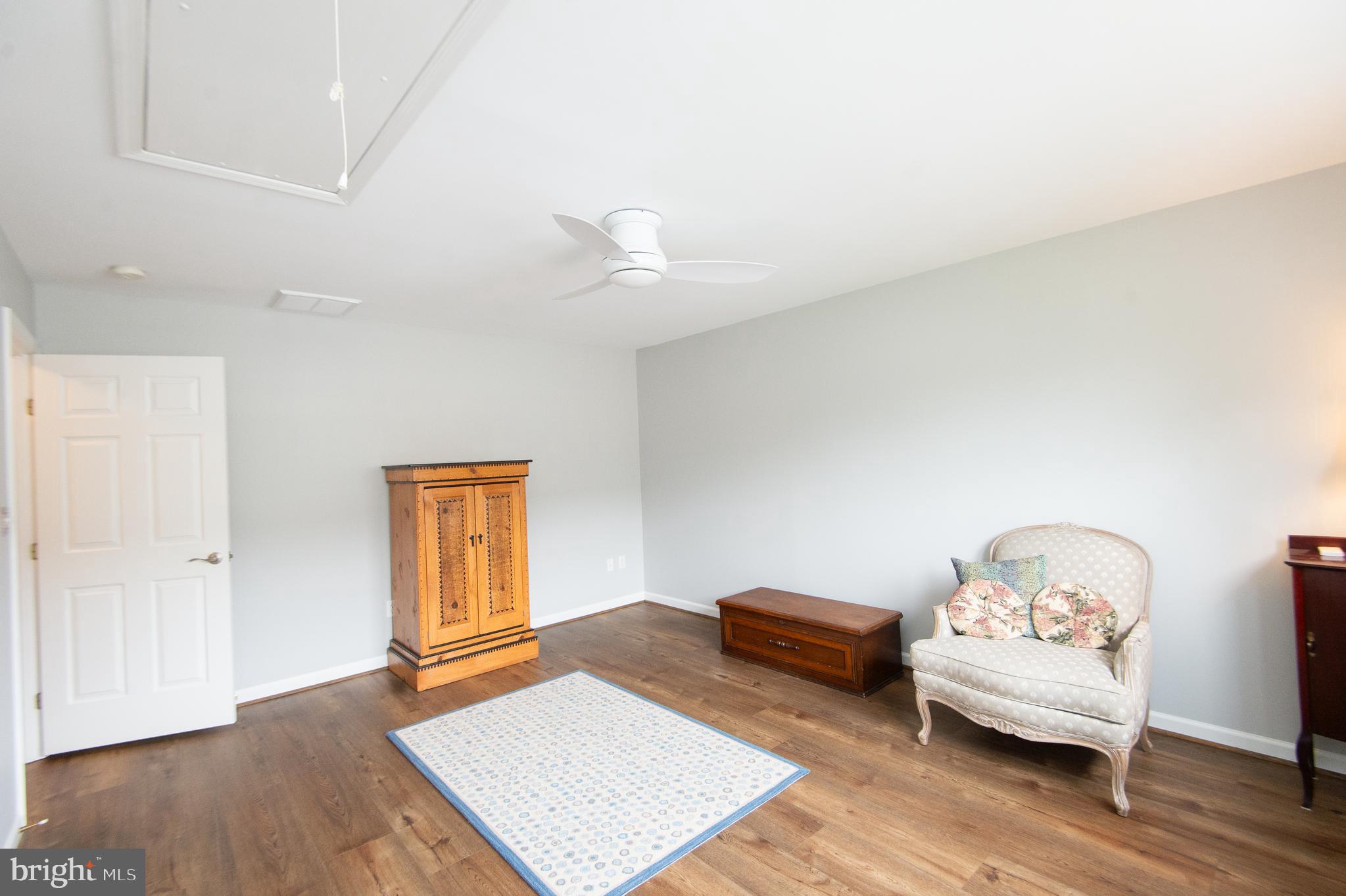 47 Brighton Street Ocean View, DE 19970 - Photo 32 of 44 a bedroom with furniture and wooden floor