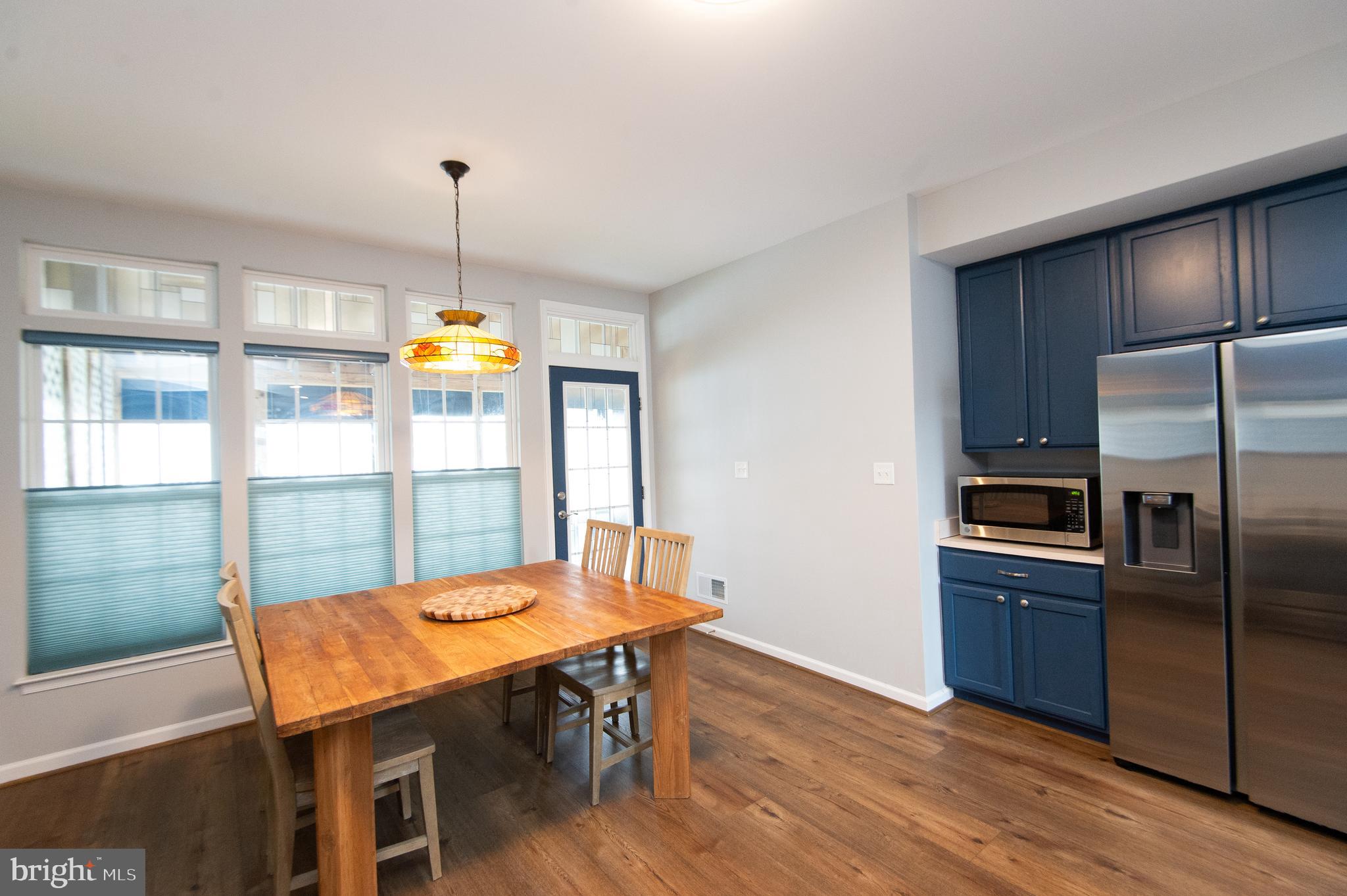47 Brighton Street Ocean View, DE 19970 - Photo 9 of 44 a view of a dining room with furniture window and wooden floor