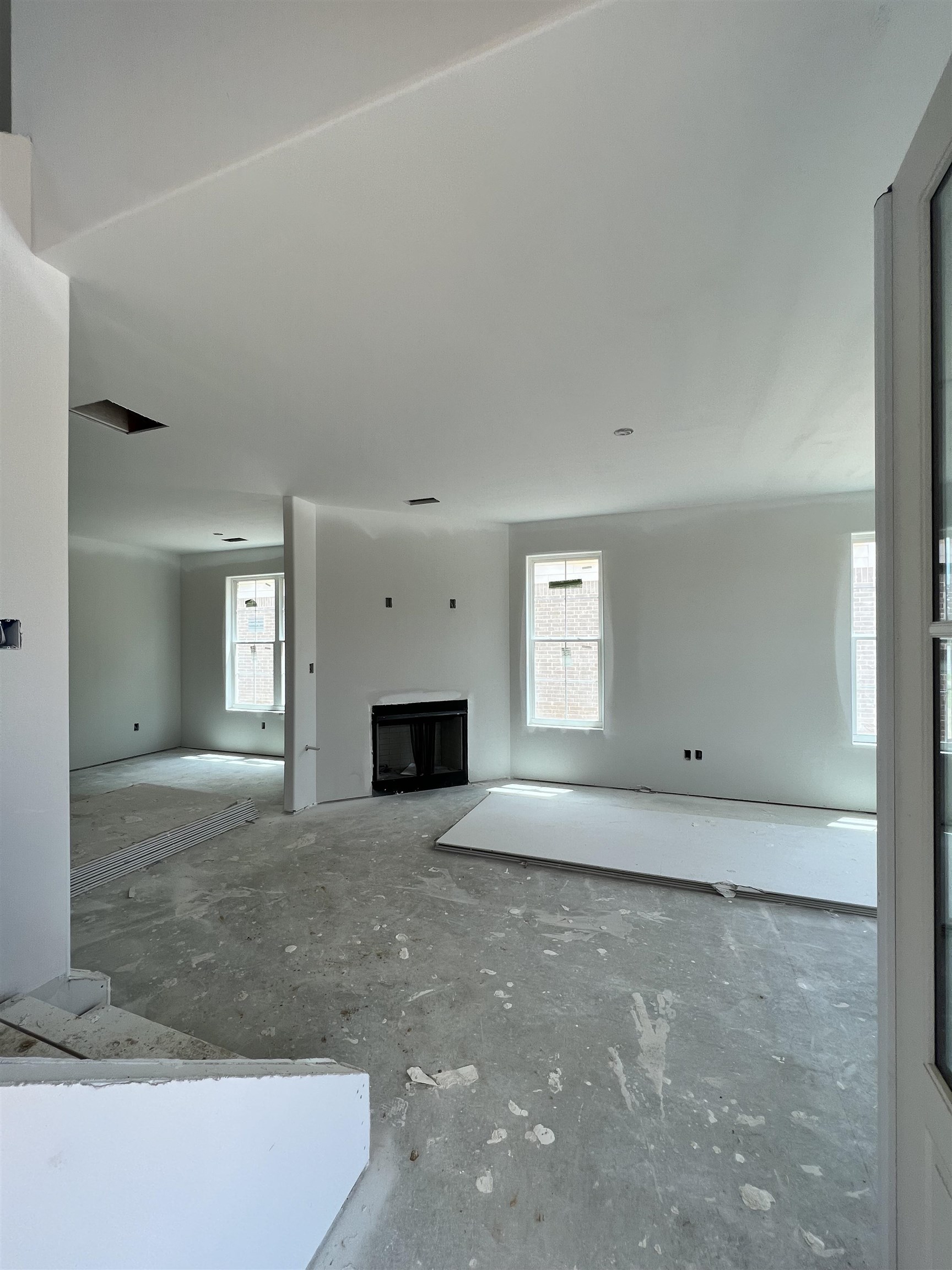 8633 Colleton Way Cordova, TN 38018 - Photo 5 of 9 a view of empty room with window and fireplace