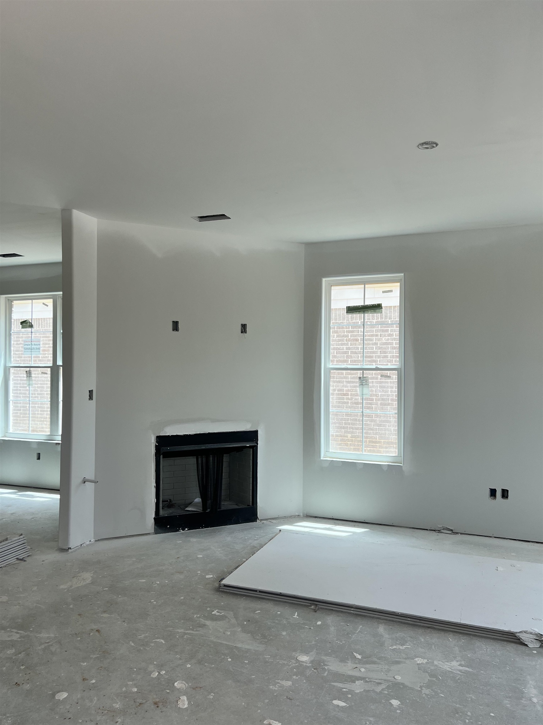 8633 Colleton Way Cordova, TN 38018 - Photo 6 of 9 a living room with a fireplace and a window